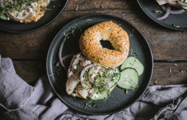 DELI TURKEY MEAT ON AN EVERYTHING BAGEL WITH RED ONION, CUCUMBER, ALFALFA SPROUTS AND GOAT CHEESE