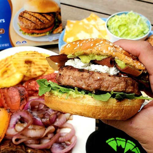 holding a gourmet turkey burger