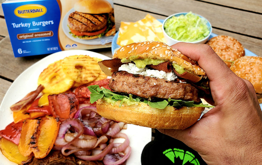 holding a gourmet turkey burger