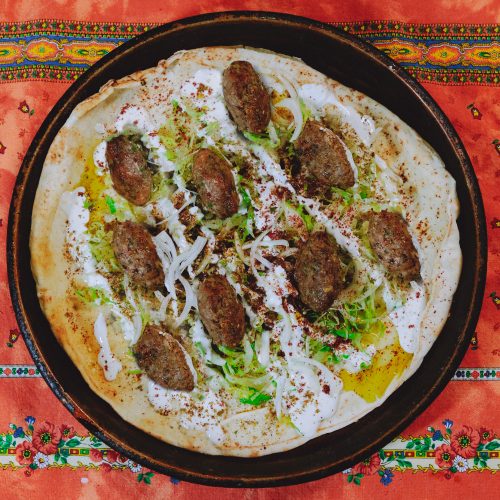 Turkey meatballs served in pita topped with yogurt sauce and shredded romaine