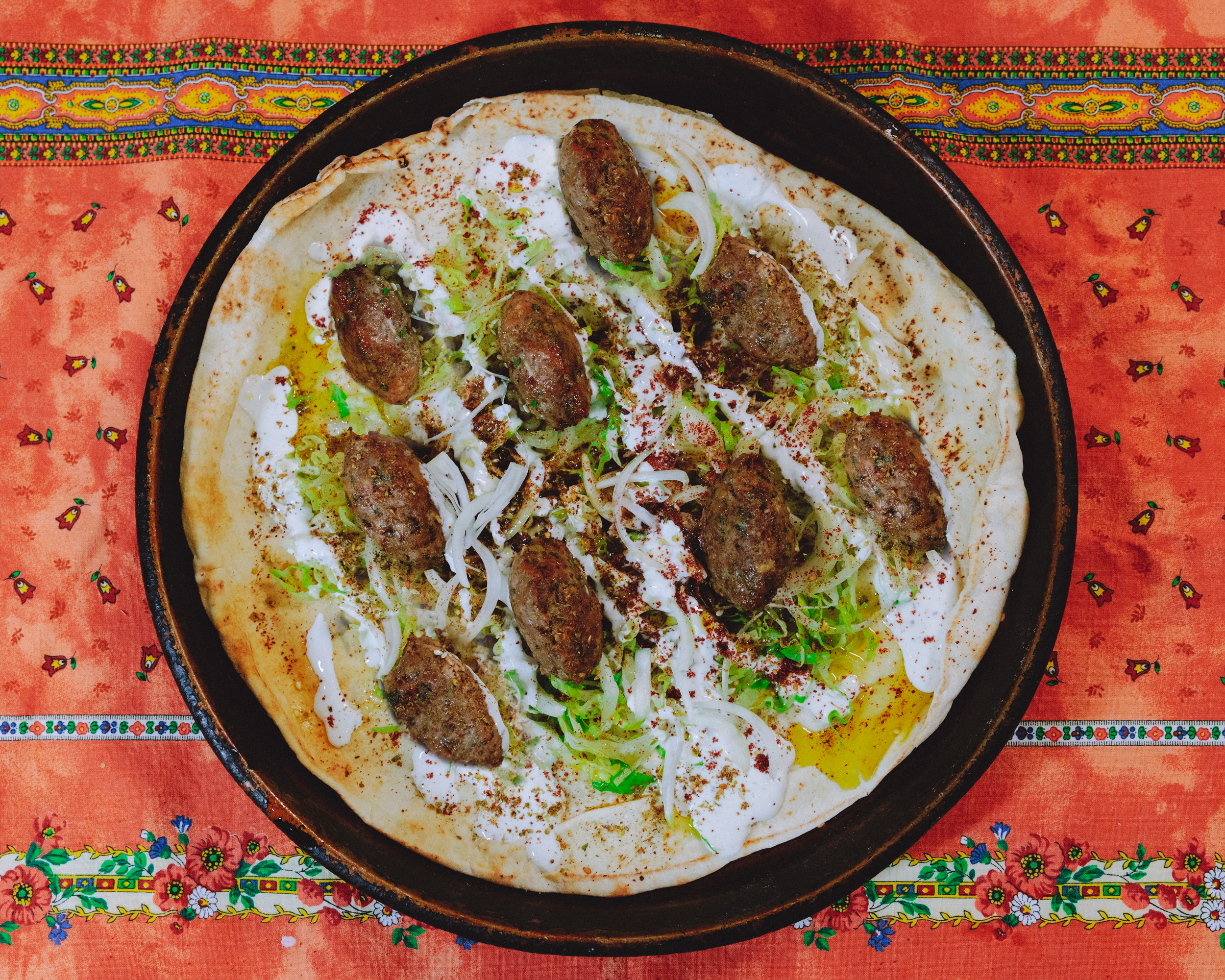 Turkey meatballs served in pita topped with yogurt sauce and shredded romaine