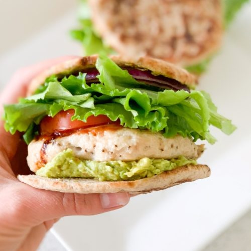 holding a Guacamole Turkey Burger