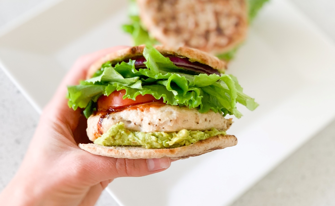 holding a Guacamole Turkey Burger