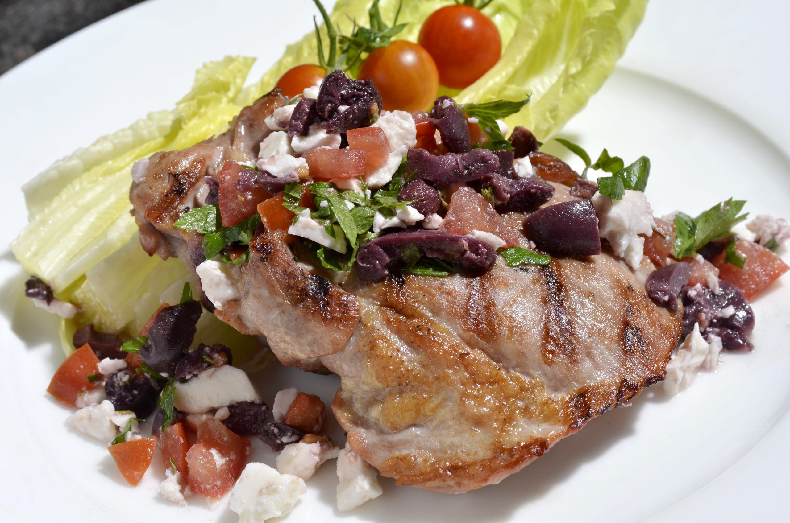 Grilled Turkey Thighs Niçoise on a plate