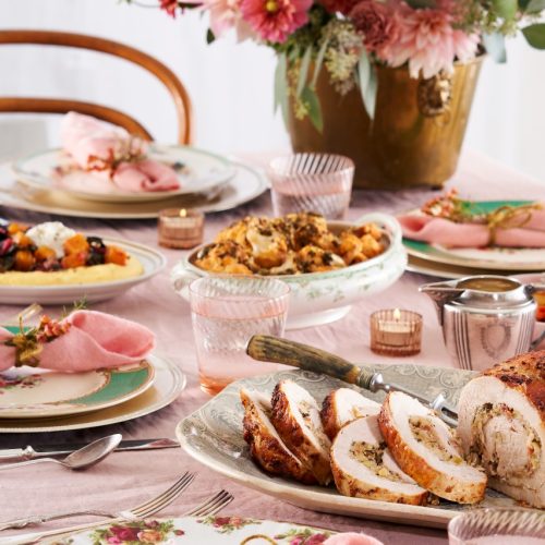 Roasted Turkey Breast “Porchetta Style” with Pancetta, Apple, & Fennel on a vintage decorated dinner table