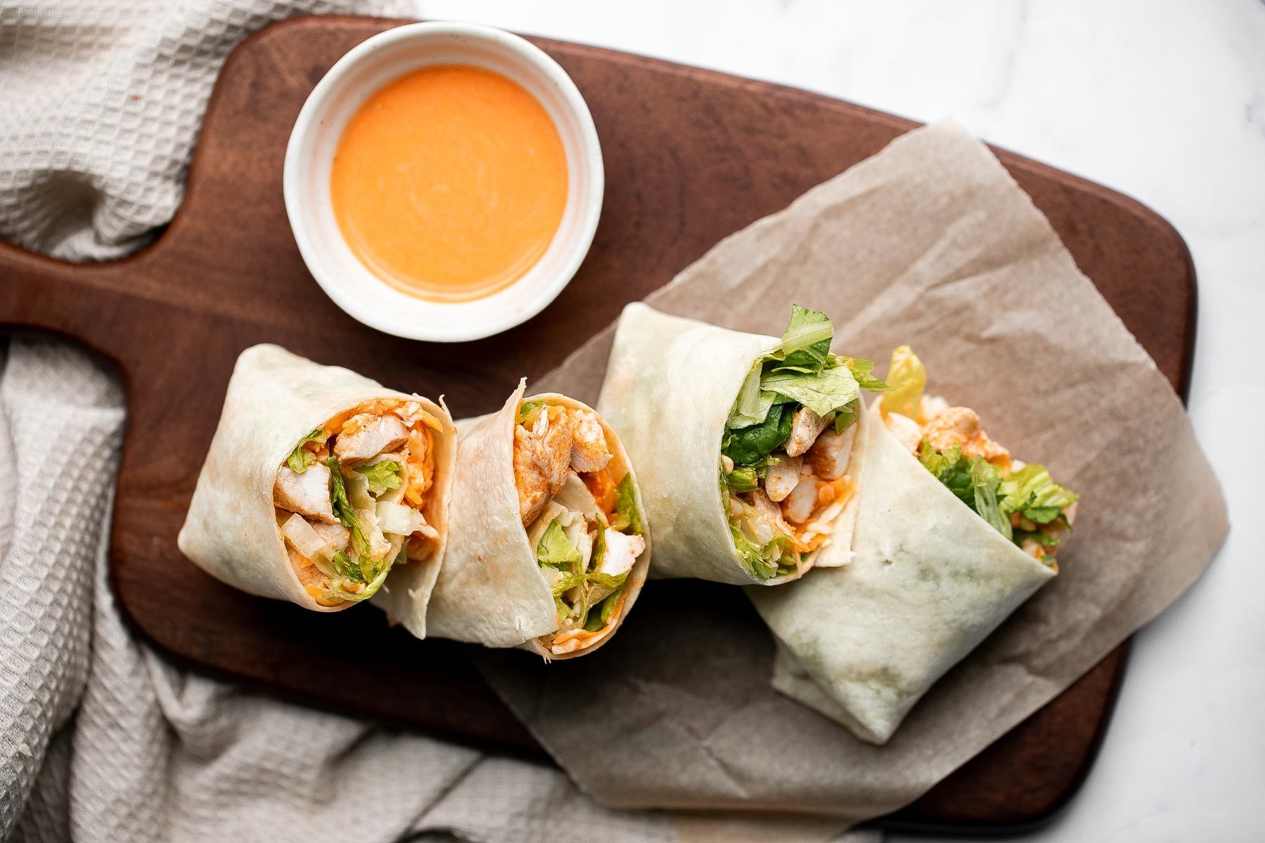 Buffalo Turkey Wraps on a serving board