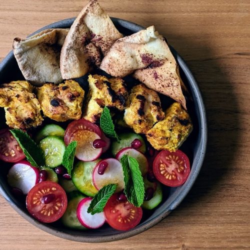 BBQ Turkey Skewers with Zaatar, Fattoush Salad and Sumac Pita in a pan