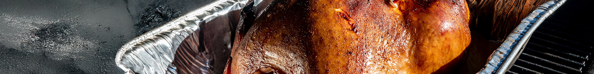 barbecued turkey in foil pan