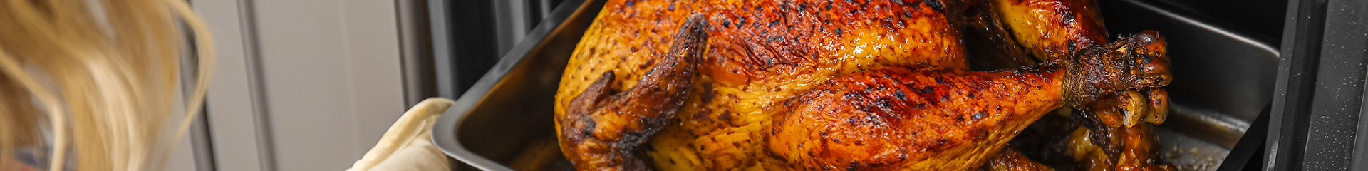 roasted turkey coming out of the oven