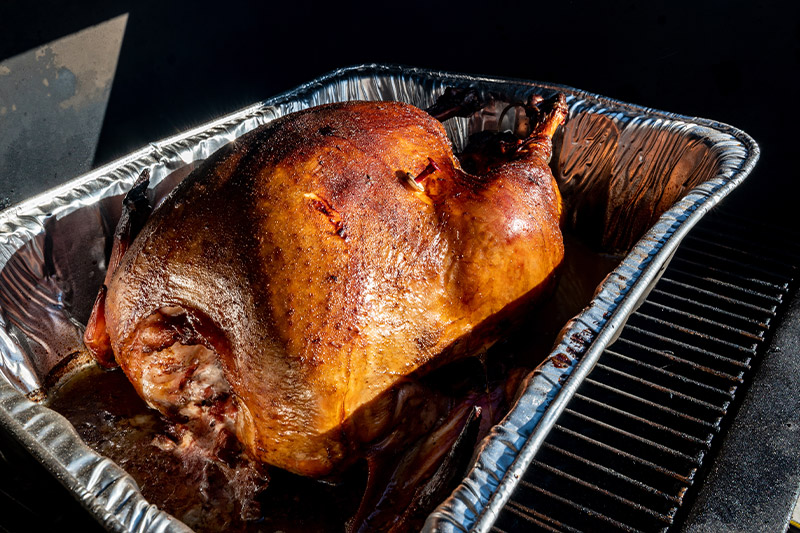 barbecued turkey in foil pan