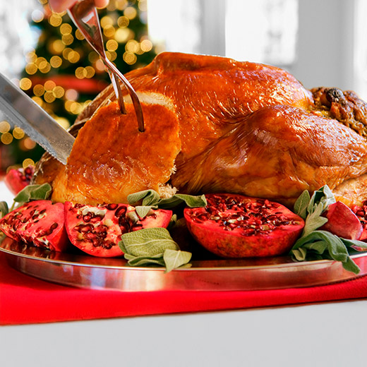 making the first slice into a holiday turkey