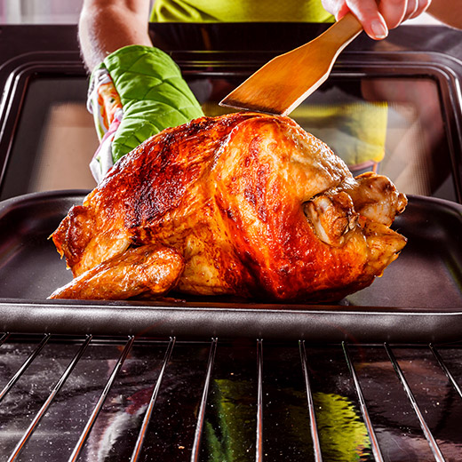 roasted turkey coming out of the oven