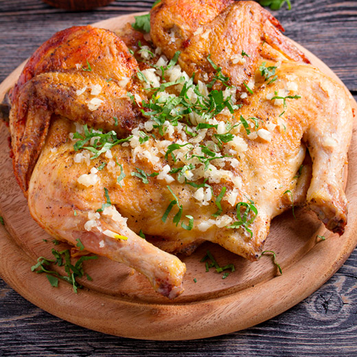 spatchcocked whole turkey presented on a cutting board